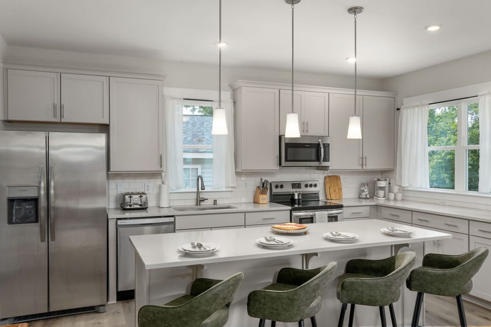 Kitchen is fully equipped with modern appliances and with ample counter spaces