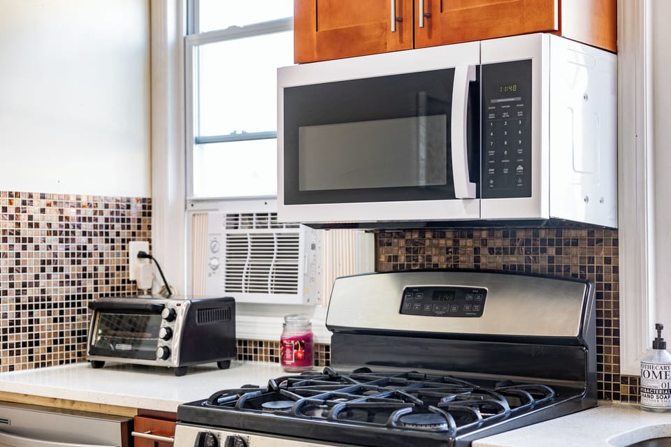 A modern kitchen equipped with everything you need to cook, dine, and unwind. 