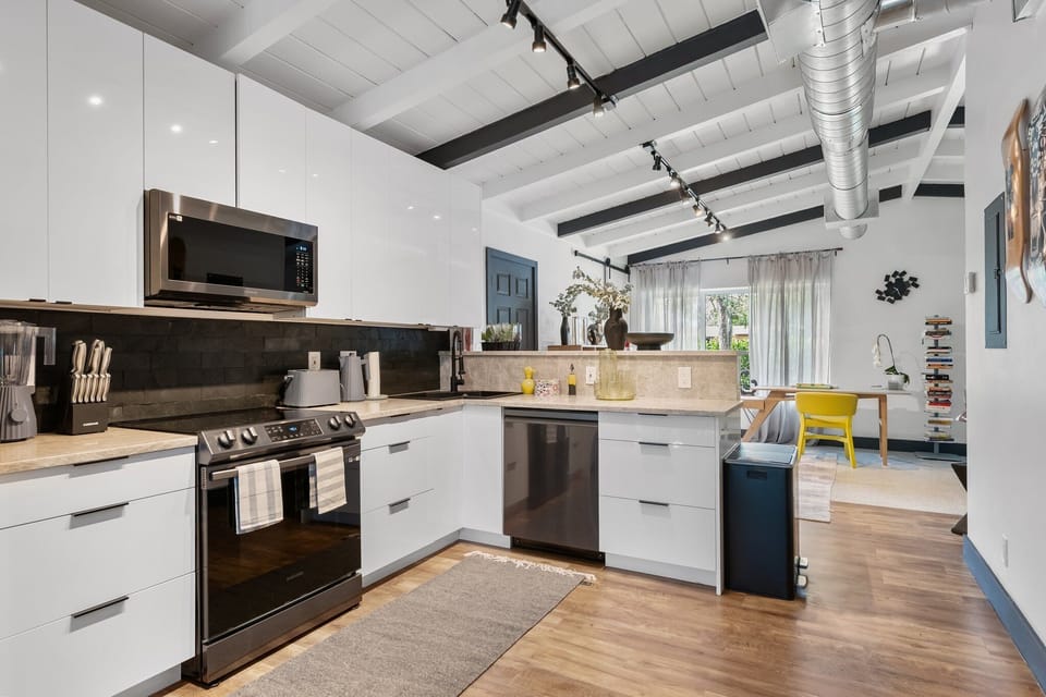 kitchen equipped with all European Alessi appliances- toaster, kettle, blender
