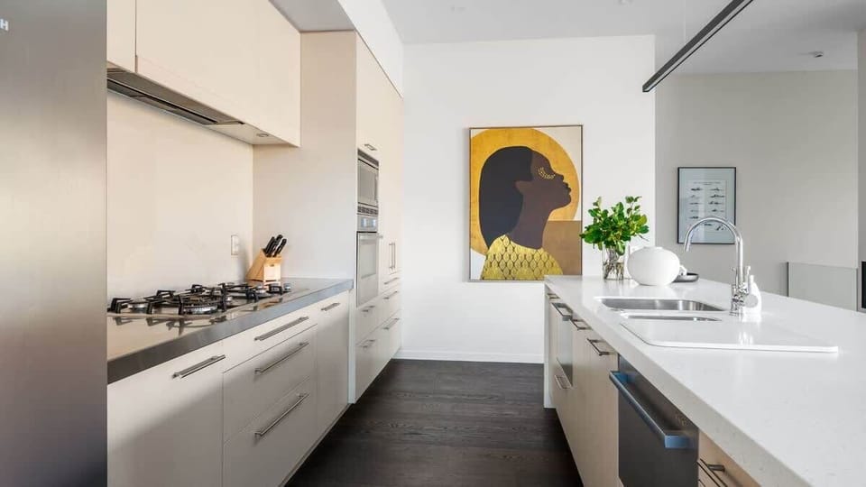 Fully Equipped Kitchen with Views
Experience the ultimate in convenience and style with the fully equipped kitchen, featuring high-end appliances, a Nespresso machine, and large windows offering scenic views.