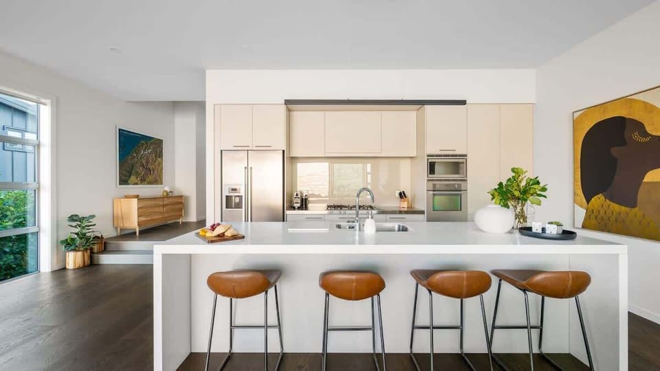Gourmet Kitchen with Scenic Views
Prepare meals in the sleek, newly renovated kitchen, featuring top-of-the-line appliances, a Nespresso machine, and stunning views that make cooking a pleasure.