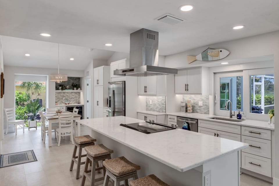 Expertly redesigned chef's kitchen featuring new appliances, cabinetry, and cookware