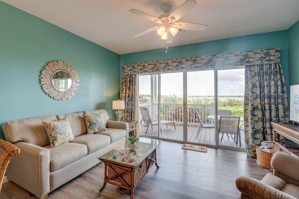 The living room at Water View Keys Retreat is bathed in abundant natural light, creating a warm and inviting atmosphere throughout the day.