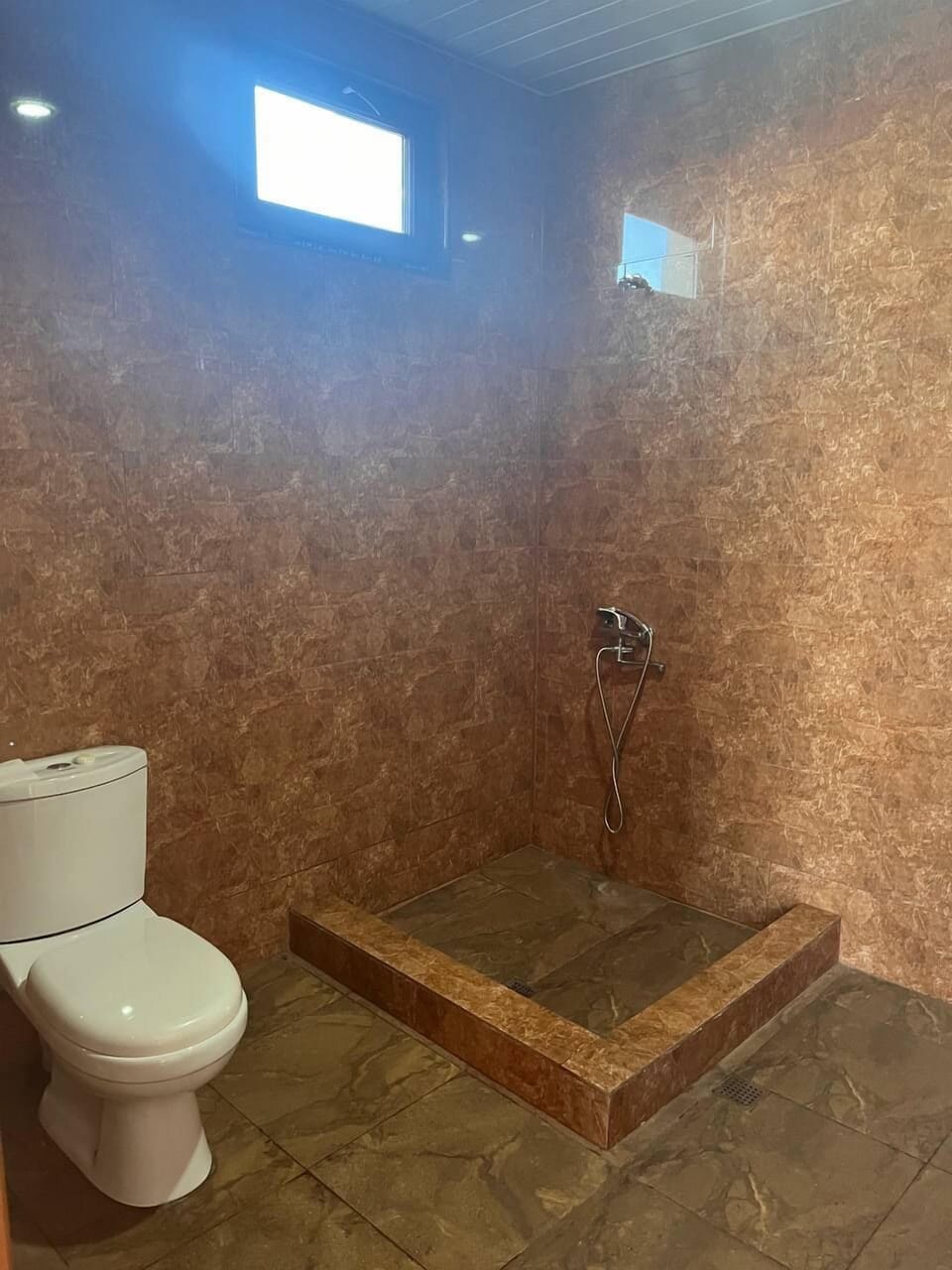 Basic Quadruple Room | Bathroom | Shower, hair dryer, towels, soap