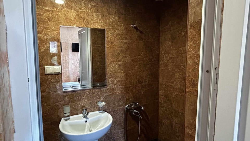 Family Quadruple Room | Bathroom | Shower, hair dryer, towels, soap