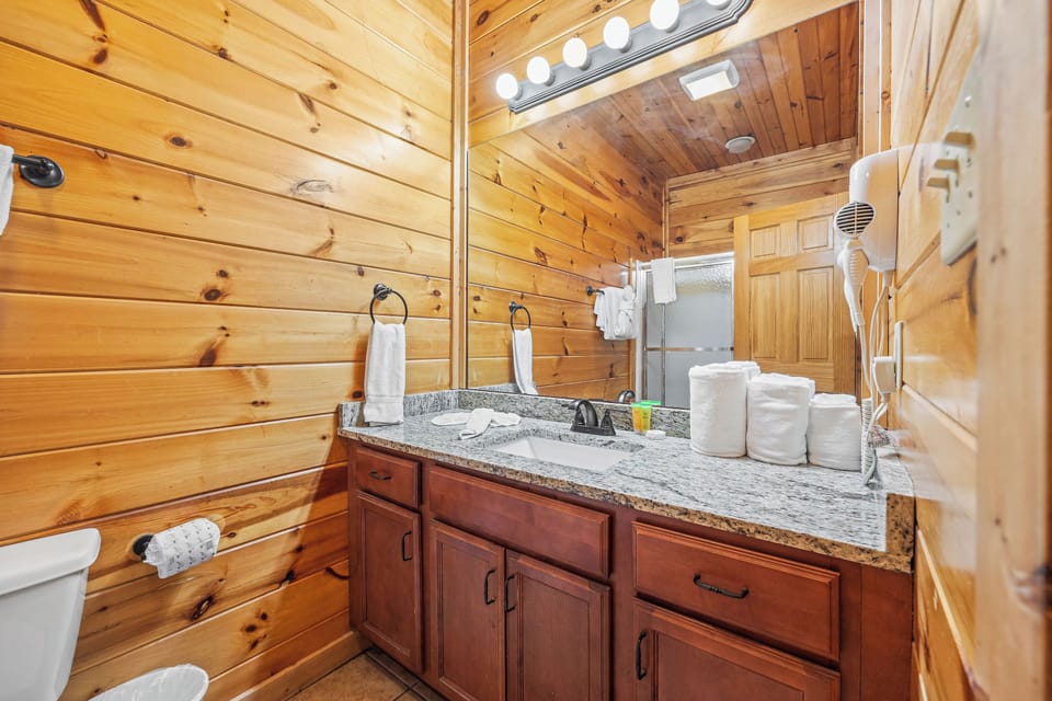 Entry level ensuite full bathroom with tub/shower combo