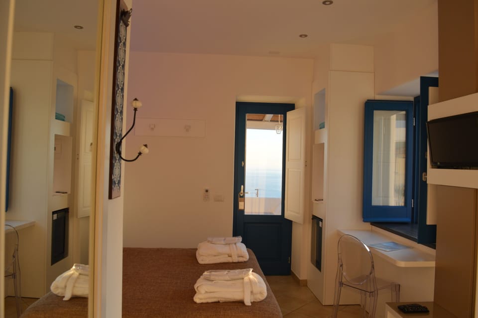 Deluxe Double Room, Balcony, Sea View | Minibar, in-room safe, desk, free WiFi