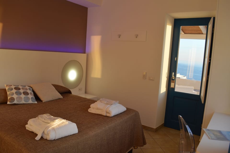 Deluxe Double Room, Balcony, Sea View | Minibar, in-room safe, desk, free WiFi