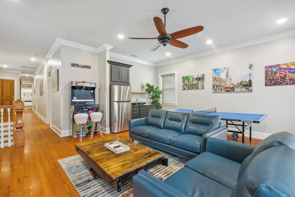 Upstairs game room includes refrigerator with ice maker, 65" smart tv, ping pong table, video arcade machine and a Nostalgic Jukebox set up with "Bluetooth" to play your personal tunes.
