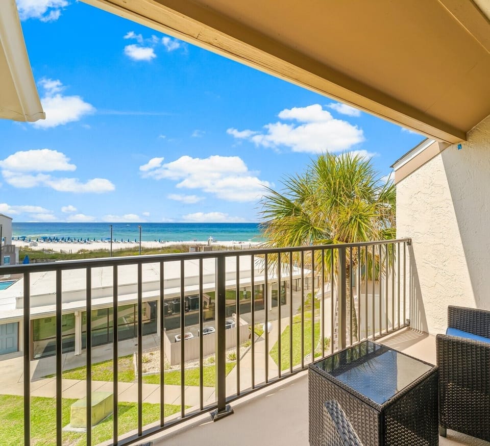 Relax on your private balcony watching the beach and ocean