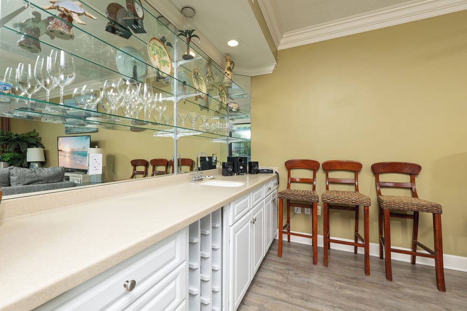 Grab a bottle from the wine rack or create your favorite cocktail at the wet bar