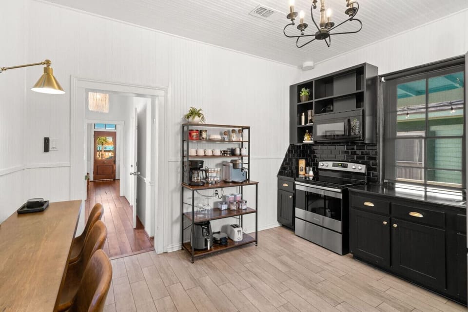 Sleek kitchen with full appliance setup.