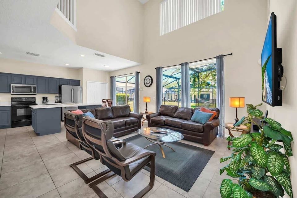 Amazing open floor plan leading to pool. Kick back after a day at Disney!