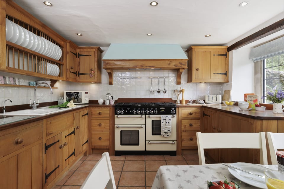 The homely, farmhouse style kitchen/dining room with range oven