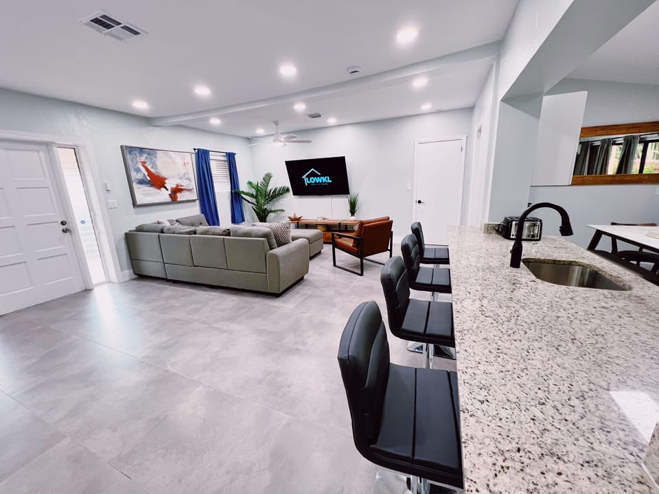 Our Living Room

Equipped with plenty of sunlight a large sectional and even bigger TV to keep you entertained through your stay. The living room is spacious for all sorts of groups.