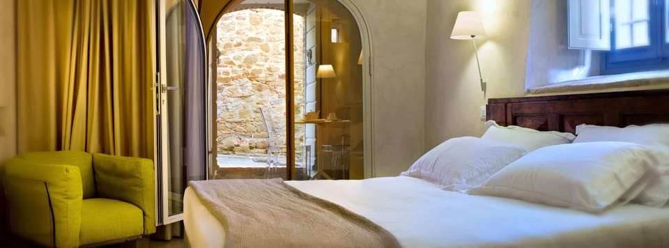 Frette Italian sheets, premium bedding, down comforters, free minibar