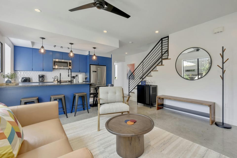Living room open to the kitchen and access to the upper level
