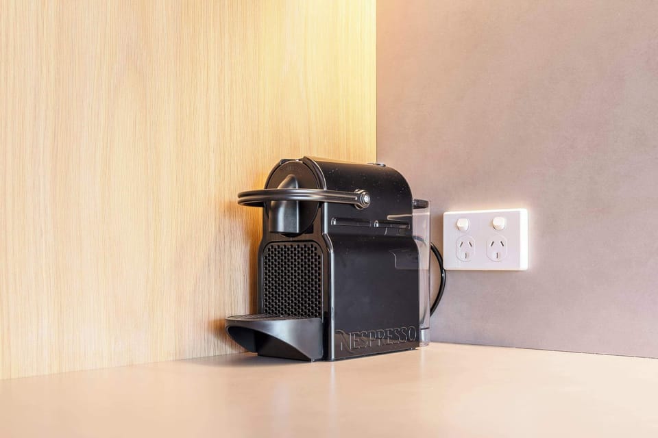 COFFEE MACHINE: Savor café-style lattes and cappuccinos every morning, effortlessly made with the provided Nespresso machine.