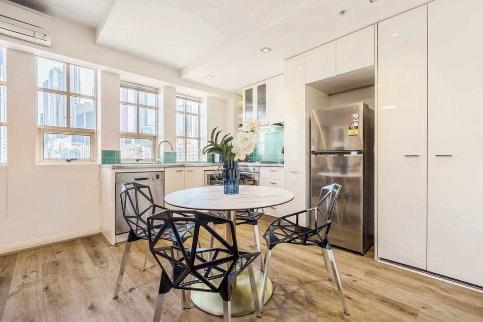 DINING AREA: Open living and bold energy. This is where clinks, bites and late-night laughter come naturally.