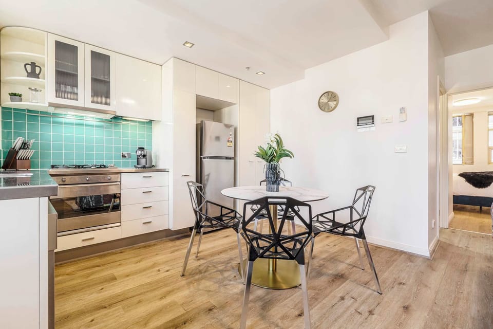 DINING AREA: Open living and bold energy. This is where clinks, bites and late-night laughter come naturally.