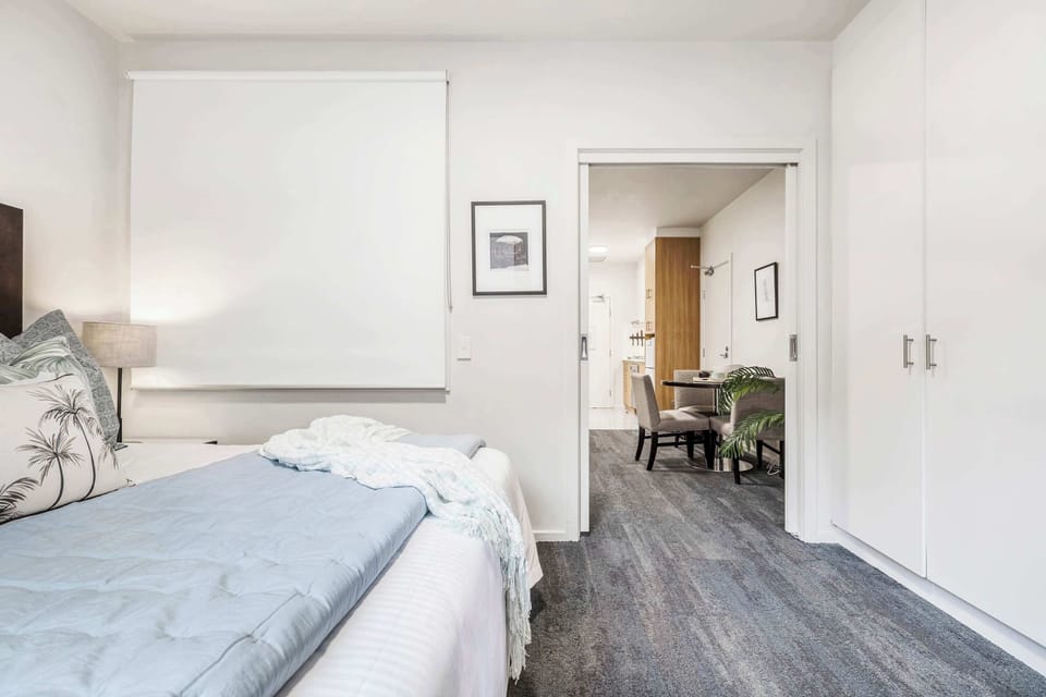Bedroom at Lagoon: Bright and cozy bedroom with soft natural light and a comfortable queen bed, perfect for a restful stay