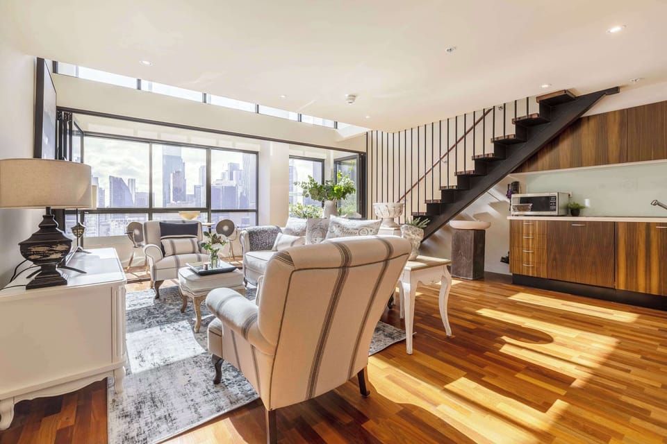 Loft style living area filled with natural light, ideal for both entertaining and relaxing