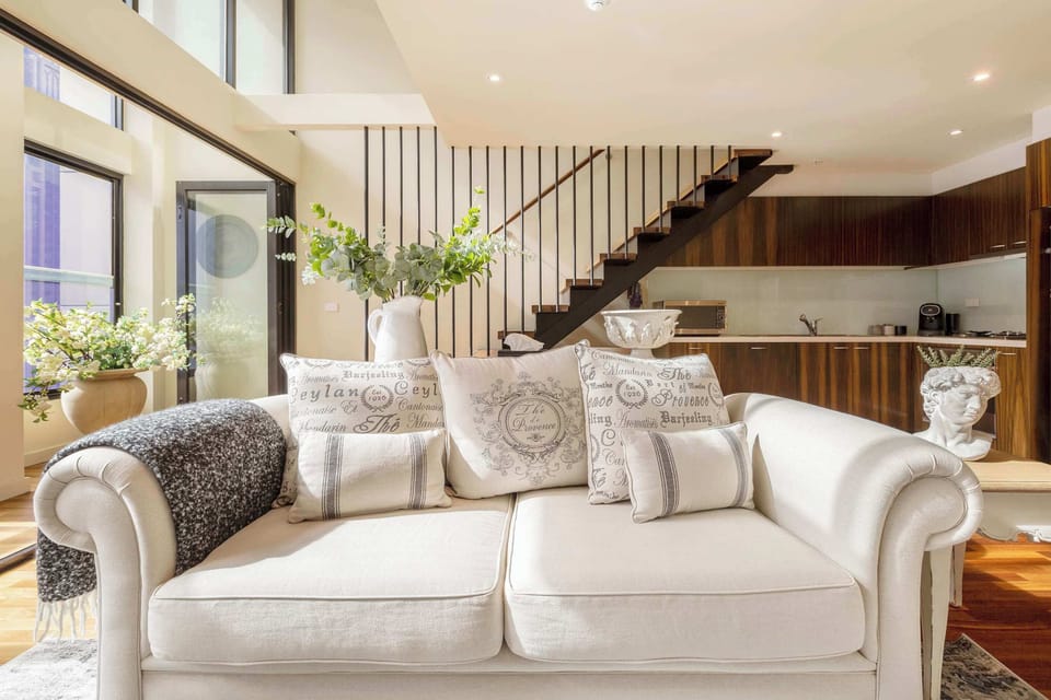 Cozy lounge corner with elegant furnishings and soft textures, perfect for relaxing after a day out