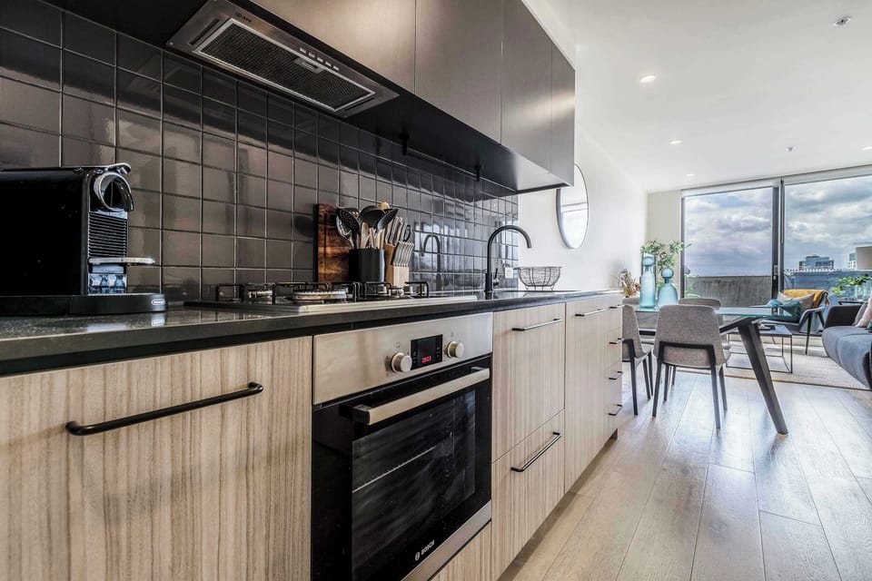 Streamlined kitchen with modern appliances and sleek finishes, perfect for cooking at home