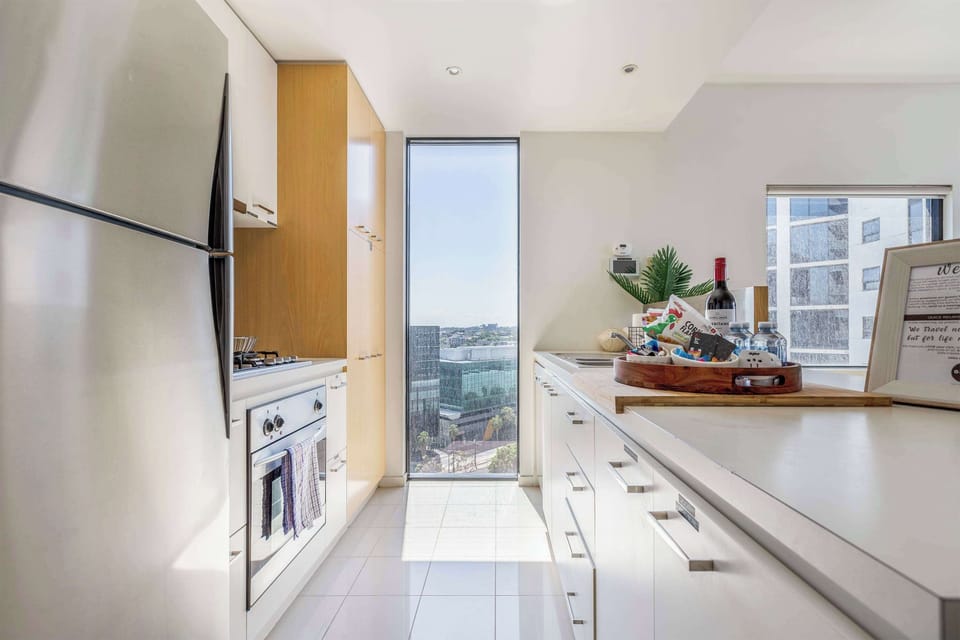 Modern kitchen with stainless steel appliances and everything you need to cook at home