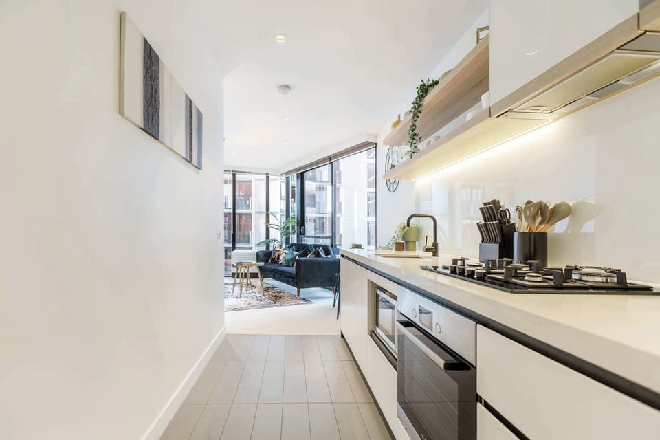 Cook with ease in the fully equipped modern kitchen, complete with sleek finishes and open shelving