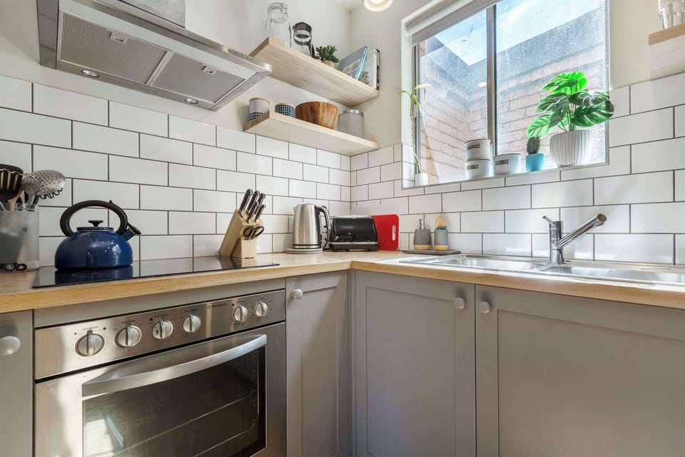 Kitchen at Sonder: Compact kitchen with natural light and everything you need for cooking