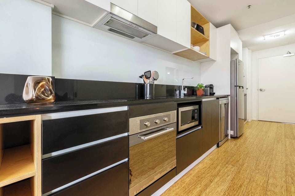 Kitchen at Verge: Equipped kitchen with stainless steel appliances and ample counter space