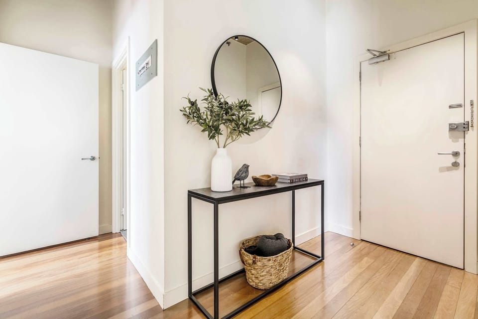 Welcoming entry with chic décor and storage space