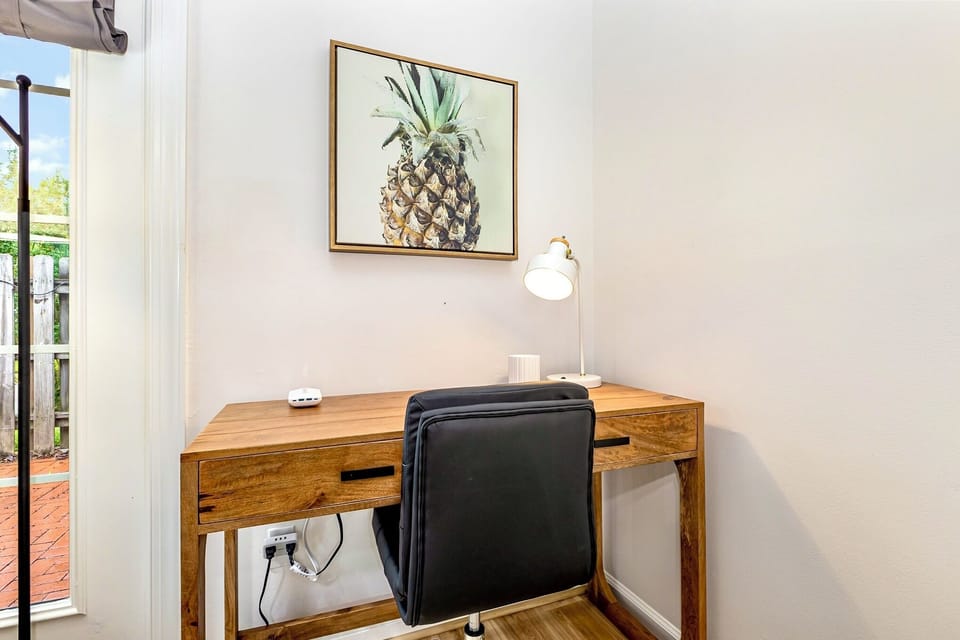 Dedicated workspace with accessible power and comfy chair.