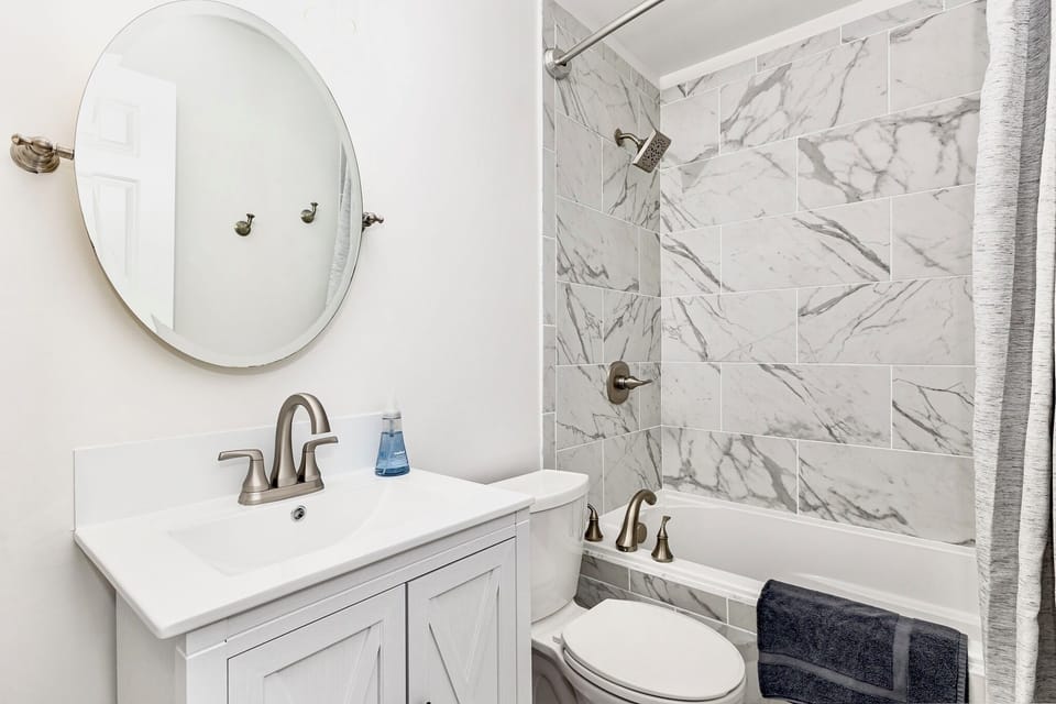 Full bath with shower and tub combo.