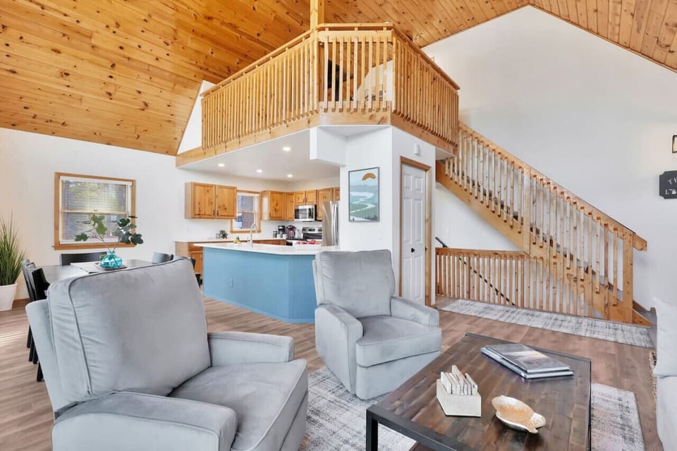Spacious main living & dining area with upper level loft or remote work space.