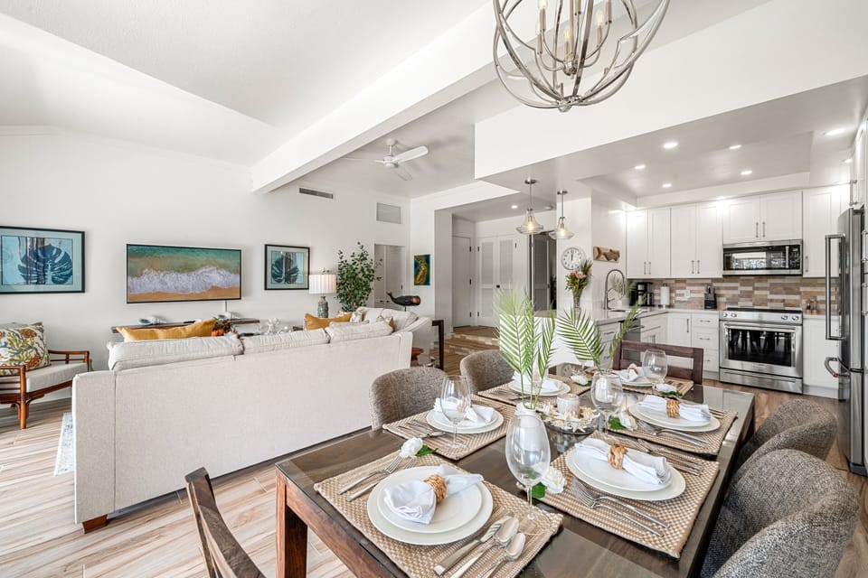 Beautifully arranged dining table with tropical accents, blending sophistication and warmth for a perfect island dining experience.