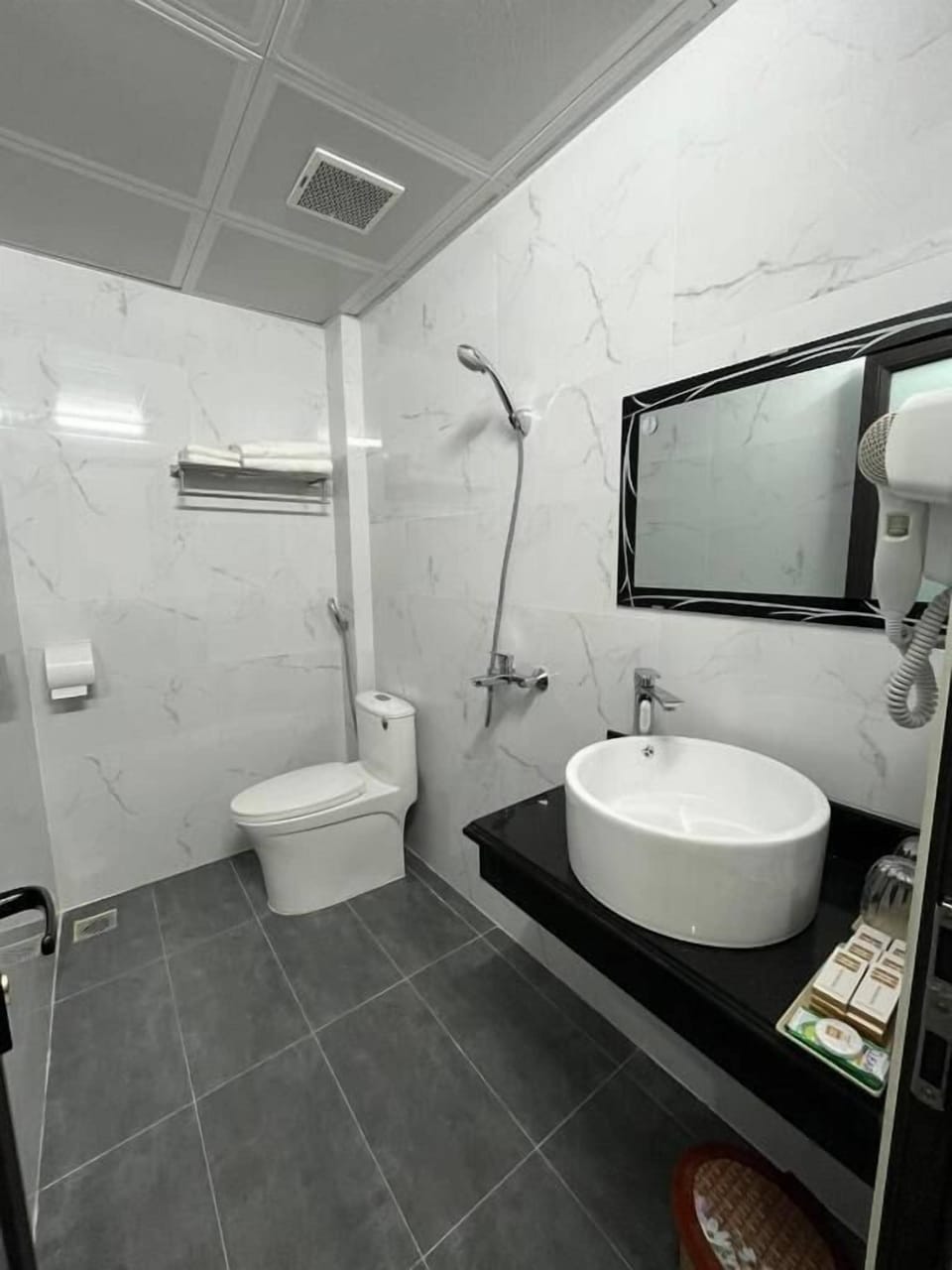 Shower, free toiletries, hair dryer, slippers