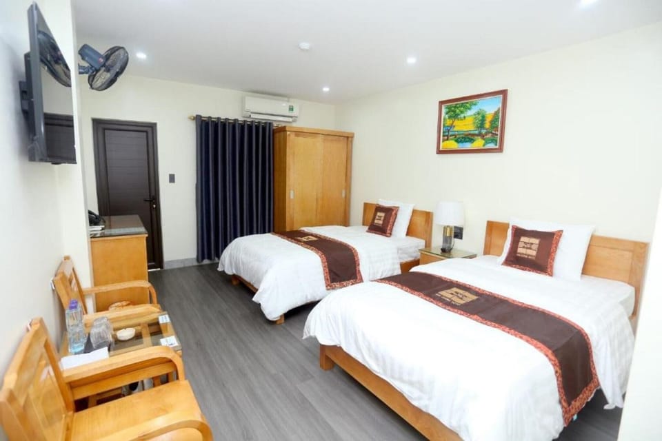 Twin Room | Minibar, blackout drapes, WiFi (free), bed sheets