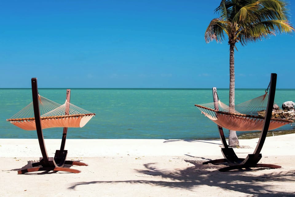 On the beach, beach cabanas, sun loungers