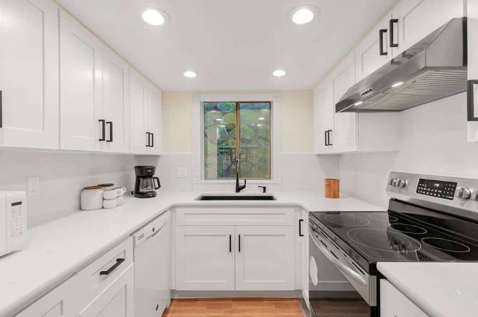 Within this culinary haven, modern appliances stand ready to assist in culinary endeavors, while generous counter space beckons creativity and convenience alike.