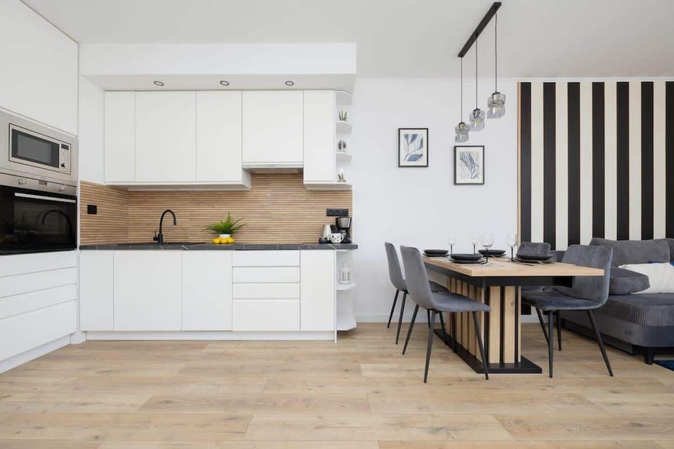 The bright, spacious kitchen with a large worktop encourages shared cooking and preparing home-style meals.