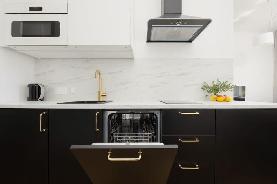 The compact kitchen area with a microwave, oven, and worktop meets your needs for both quick breakfasts and home-cooked dinners.