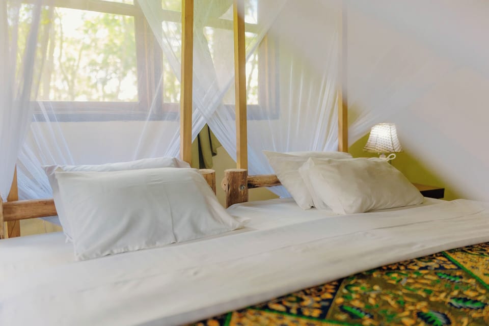 Desk, laptop workspace, bed sheets