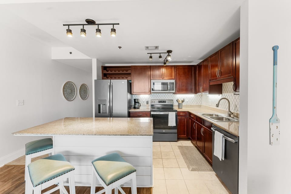 Modern kitchen with granite countertops and stainless steel appliances