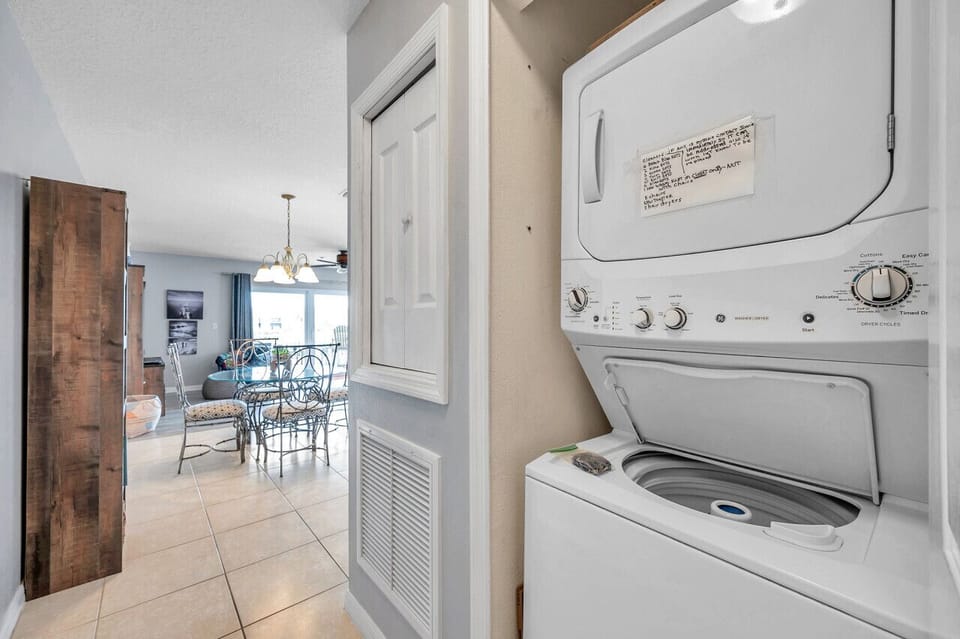 Convenient in-unit washer & dryer tucked neatly in the hallway.