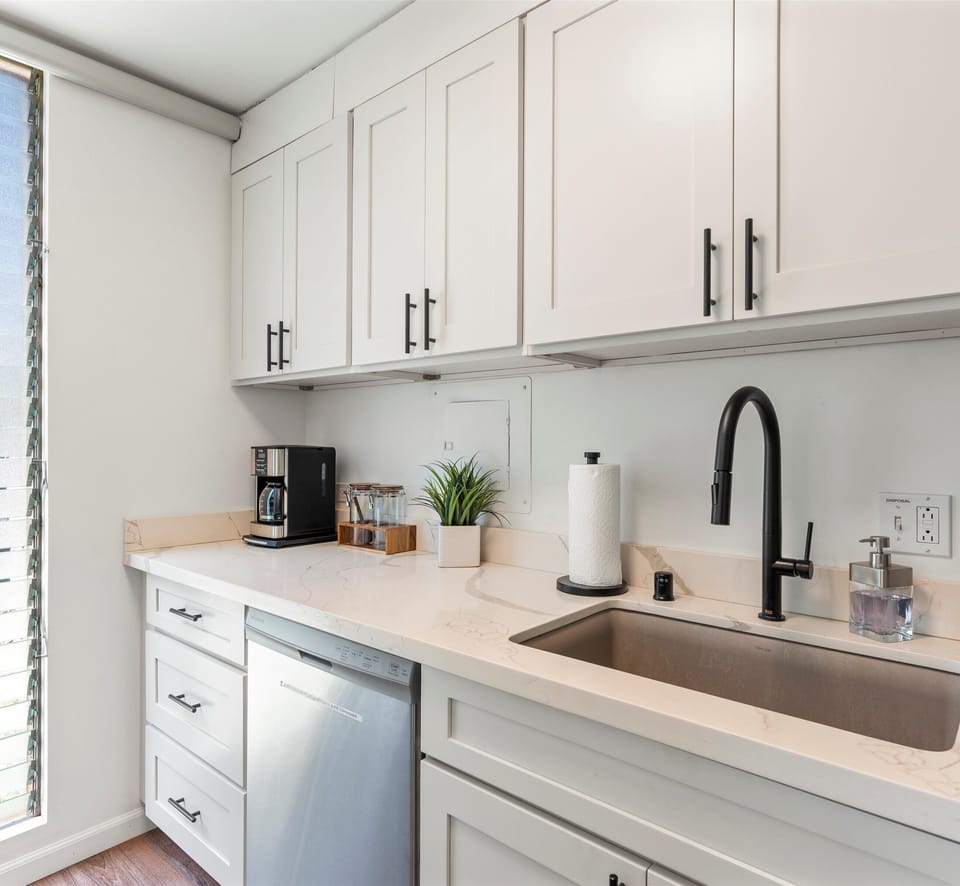 Your bright, fully equipped kitchen features elegant cabinetry, modern appliances, and thoughtful touches—perfect for brewing morning coffee or preparing homemade meals during your stay.