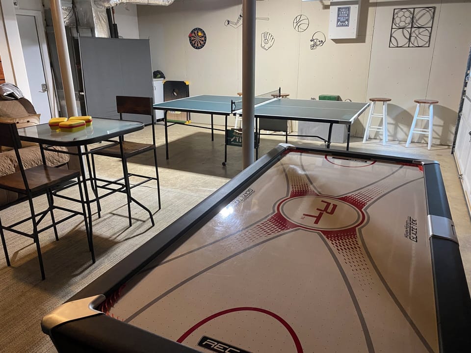 Game Room lower level with air hockey and pingpong table and plenty of seating