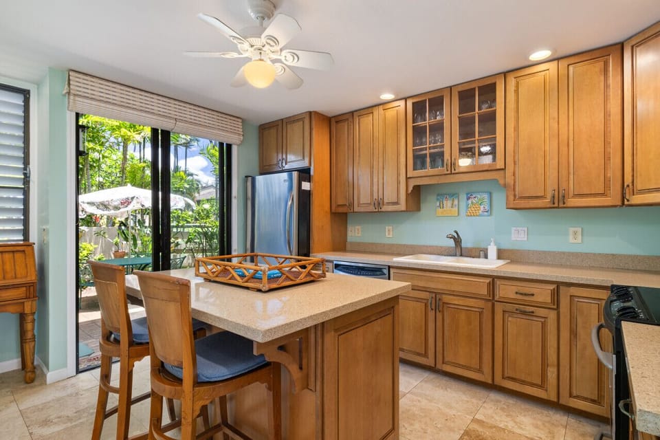Bright kitchen w/ roomy island perfect for easy vacation cooking.