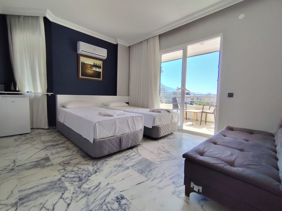 Standard Double or Twin Room, Partial Sea View | Minibar, desk, laptop workspace, free WiFi